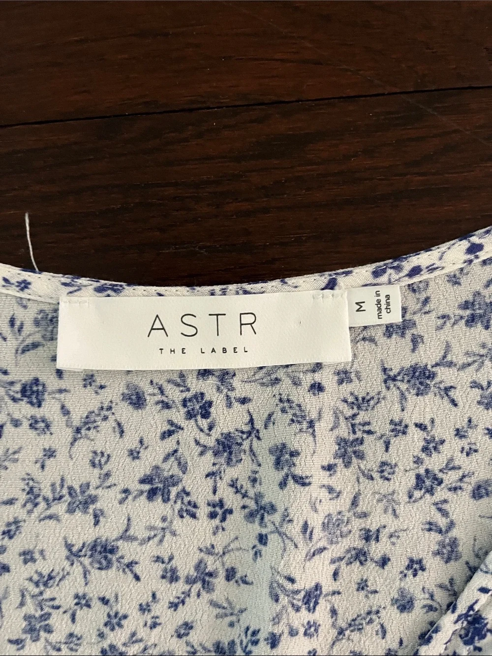 Astr Floral Long-Sleeve Smocked Crop Top in White and Blue